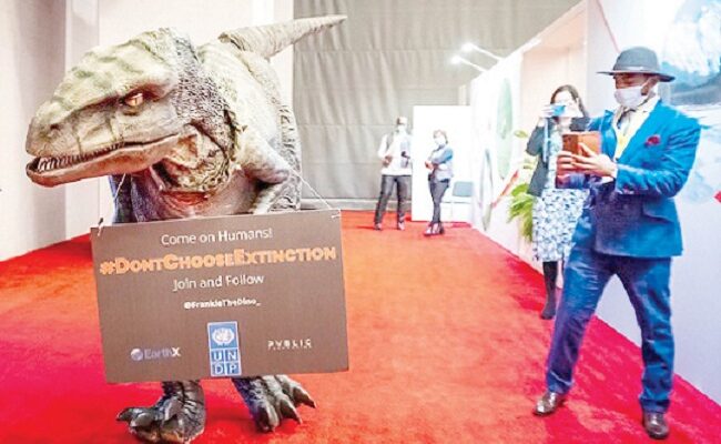 Dinosaur visits COP15 with urgent climate action message
