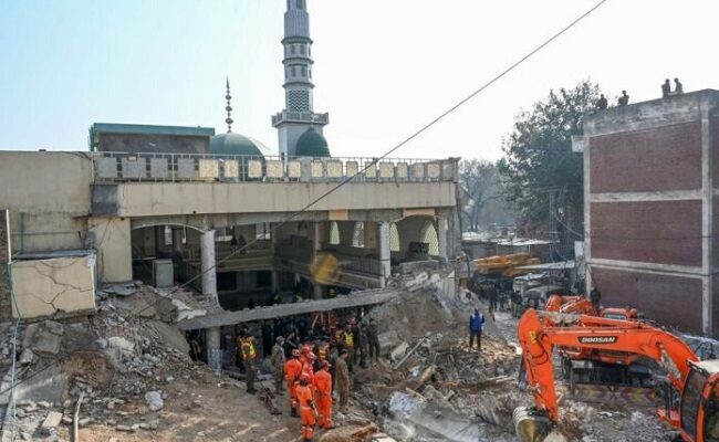 Pakistan buries mosque blast victims as death toll passes 90