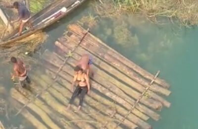 [VIDEO] Suicide Attempt: Lady jumps into Oghara River, rescued by commuters, locals