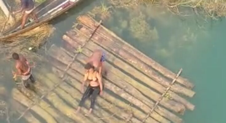 [VIDEO] Suicide Attempt: Lady jumps into Oghara River, rescued by commuters, locals