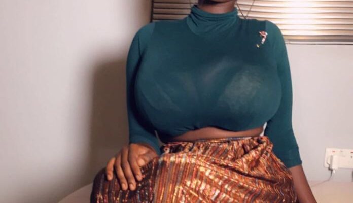 Meet the model who reportedly posses the biggest breasts in Ghana