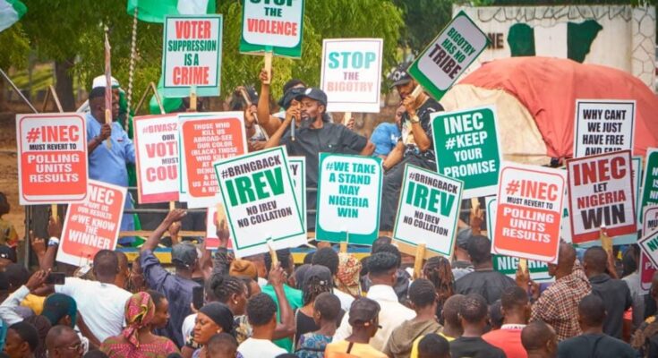 Protesters Call For Interim Govt, Arrest Of INEC Chairman