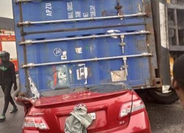 Driver Escapes Death As Container Crushes Car In Lagos