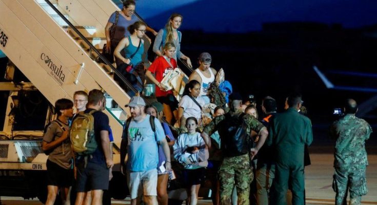 Evacuees from Niger seen disembarking an Italian flight in Rome