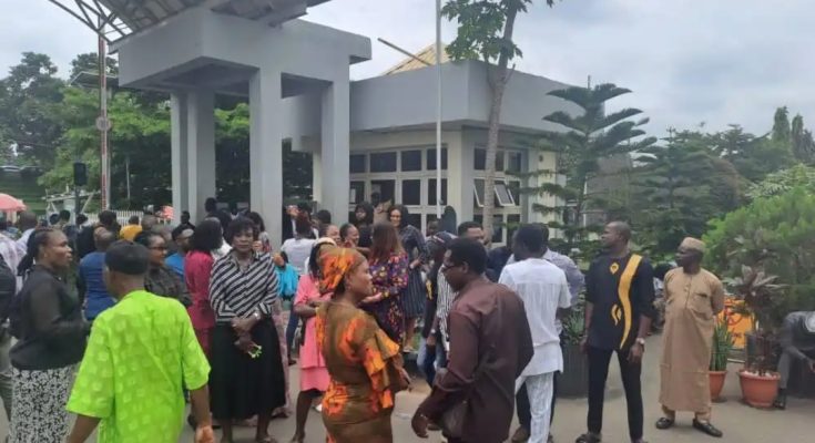 “Umahi Must Go" - Protesting Workers Lock Minister In For Locking Them Out Over Lateness To Work