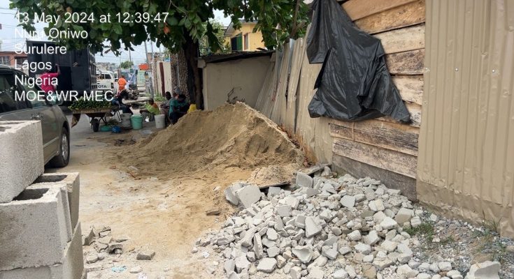 Lagos govt seals building for blocking drainage, road with building materials