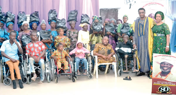 Reverend Tioluwani lauds Senator Olajumoke for donating wheelchairs food to needy