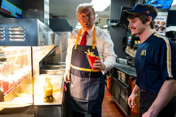 Moment Trump served fries at McDonald's ahead US election