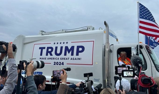 Trump rides in garbage truck after Biden calls supporters 'Garbage'