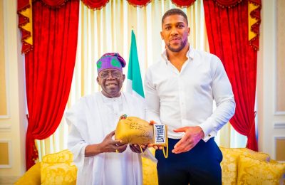 PHOTOS: Anthony Joshua visits Tinubu in Lagos, presents him with autographed glove