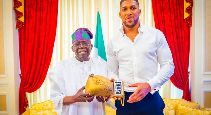 PHOTOS: Anthony Joshua visits Tinubu in Lagos, presents him with autographed glove